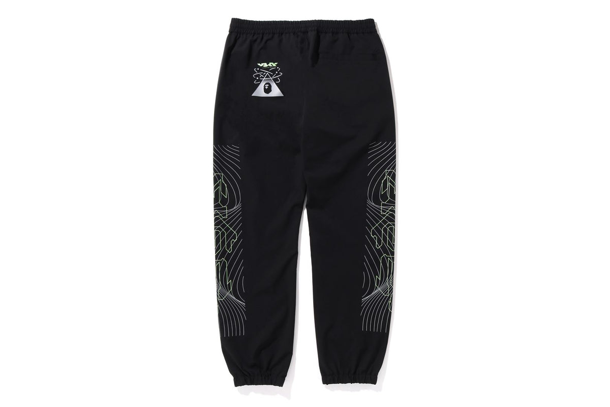 MULTI GRAPHIC TRACK PANTS